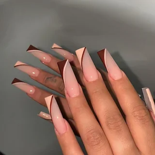 Long nude nails with angled cocoa French tips