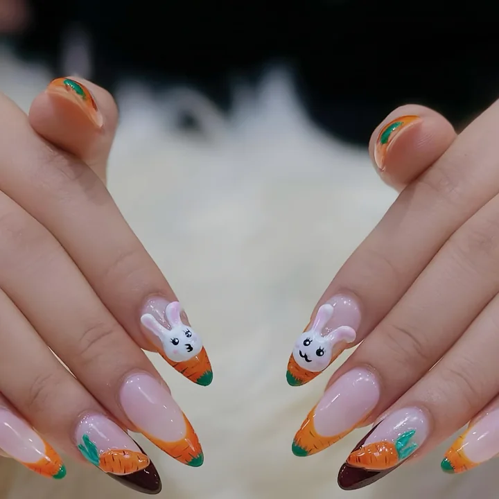 Easter nails with 3D bunny faces and orange carrot tips